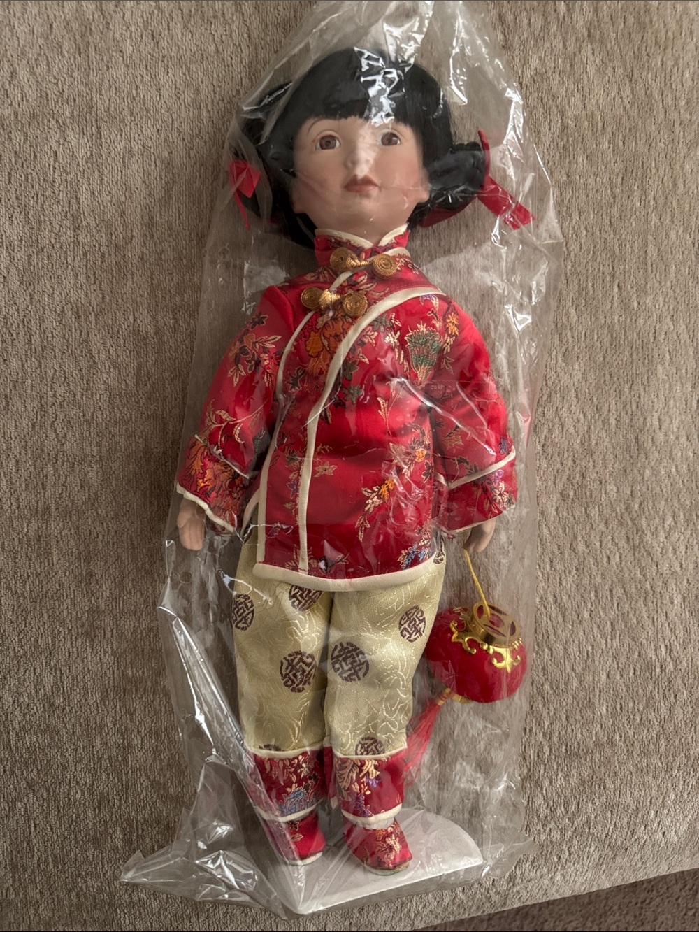 Traditional Red Porcelain Doll in Embroidered Outfit
